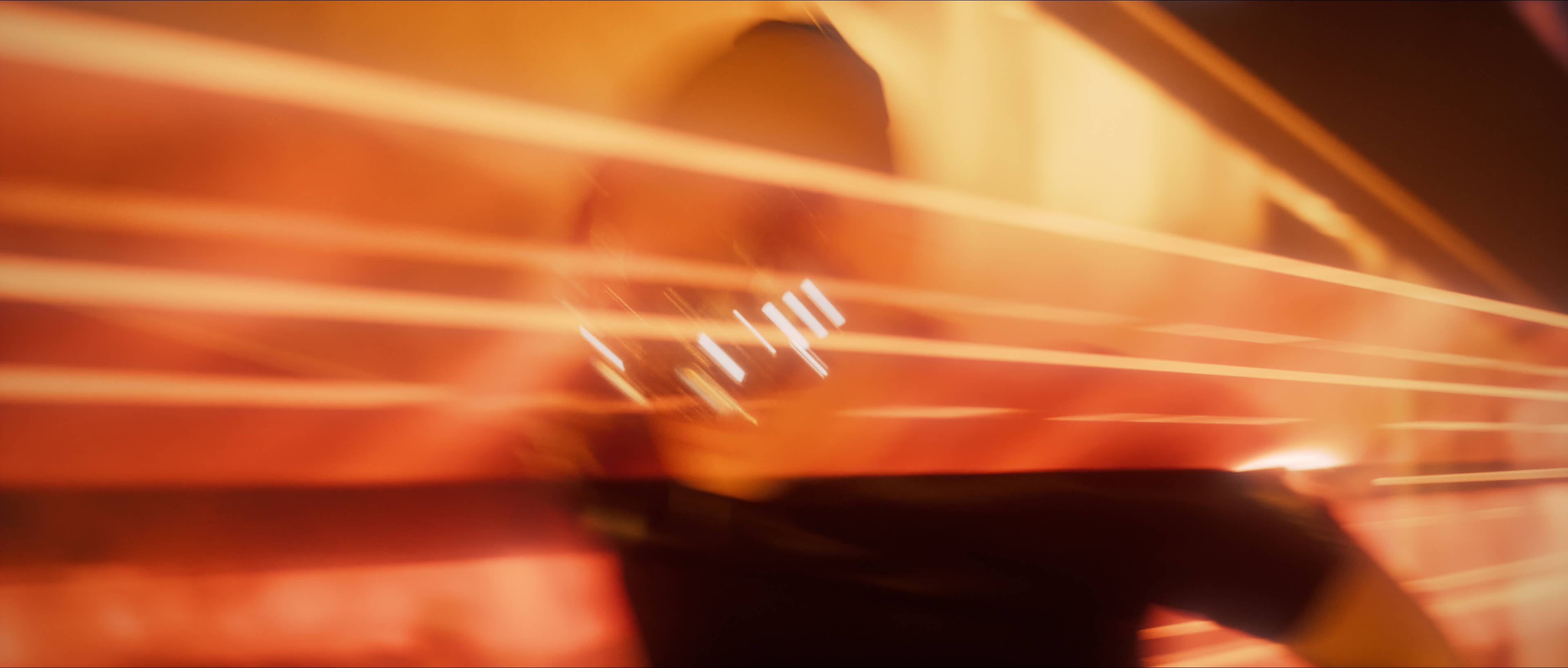 Motion-blurred chase in warm light