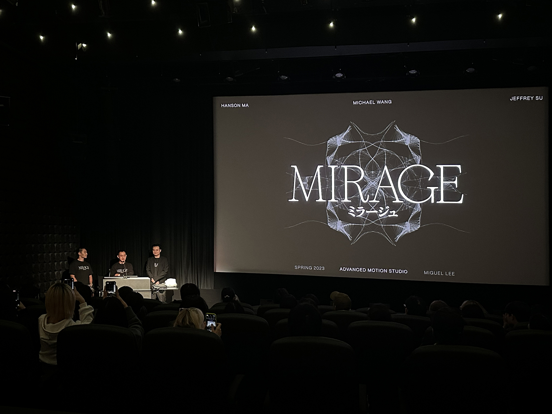 The team on stage under the Mirage title card