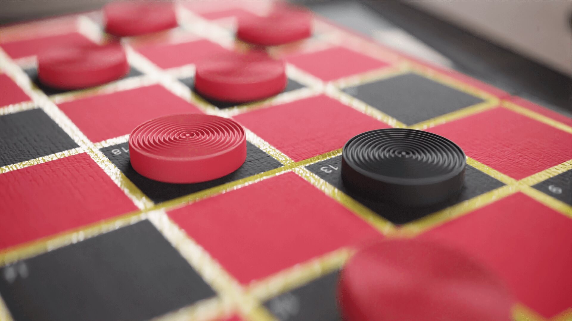 Close-up of red and black checkers mid-game on the red board