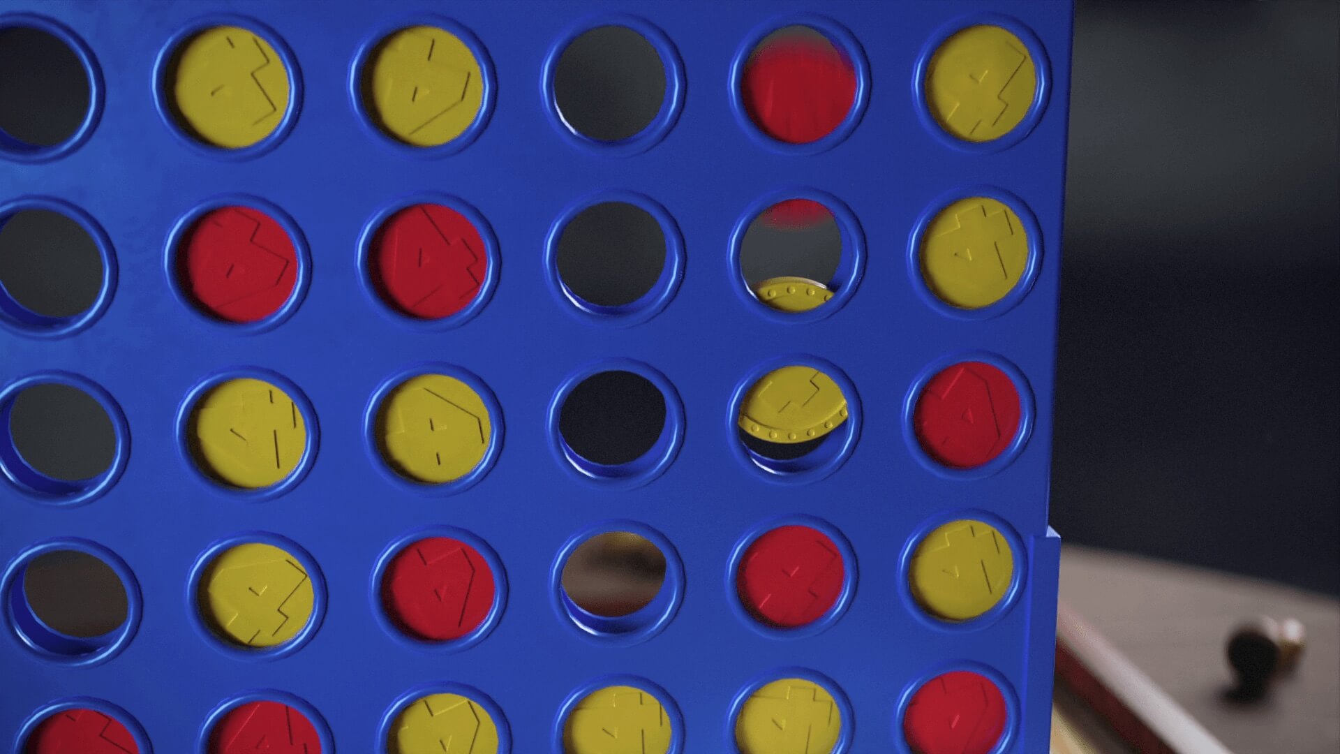 Connect 4 grid filling up with red and yellow discs